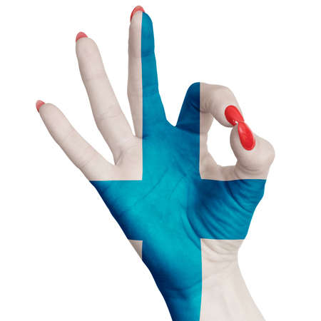 Finland national flag painted on female hand showing ok sign. Image on a white backgroundの写真素材