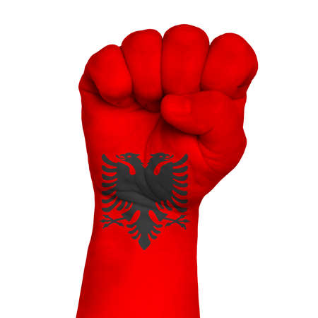 Flag Of Albania on hand with clenched fist gesture over white background.の写真素材