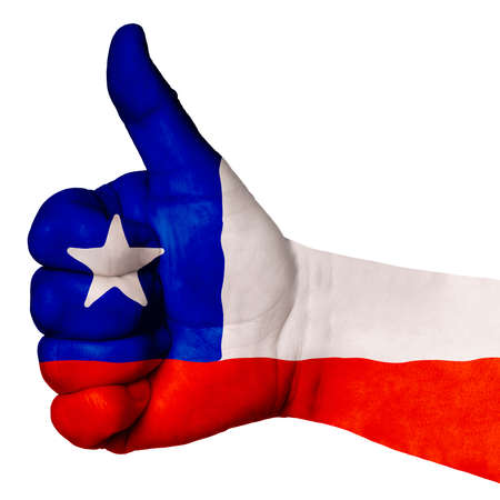 Hand with thumb up gesture in colored chile national flag as symbol of excellence, achievement, good, - for tourism and touristic advertising, positive political, social management of countryの写真素材