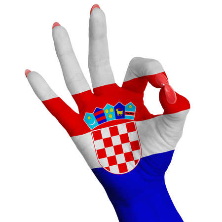 Hand making the V sign, Croatia flag painted as symbol of victory, win, success - isolated on white backgroundの写真素材
