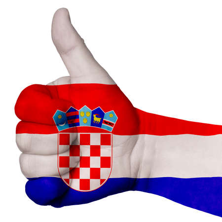 Hand with thumb up gesture colored in croatia national flag as symbol of excellence, achievement, good, - useful for tourism and touristic advertisingの写真素材