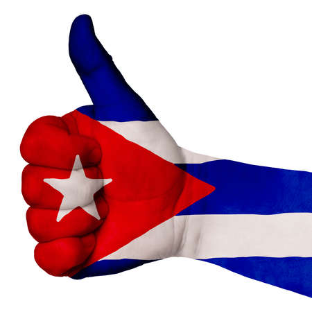 Hand with thumb up gesture in colored cuba national flag as symbol of excellence, achievement, good, - for tourism and touristic advertising, positive political, social management of countryの写真素材