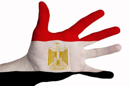A man shows the flag of Egypt in the palm of his hand. Image on a white backgroundの写真素材