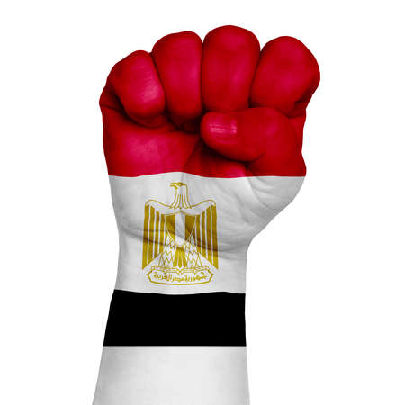 Low key picture of a fist painted in colors of egypt flag. Image on a white background. Isolateの写真素材