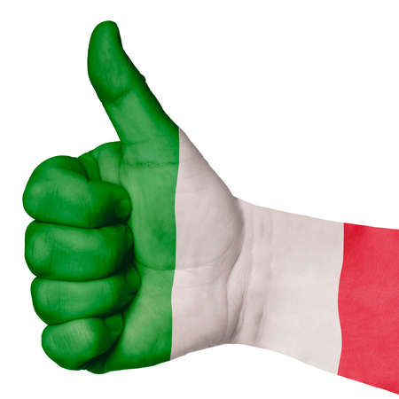 Hand with thumb up gesture in colored italy national flag as symbol of excellence, achievement, good, - useful for tourism and touristic advertisingの写真素材