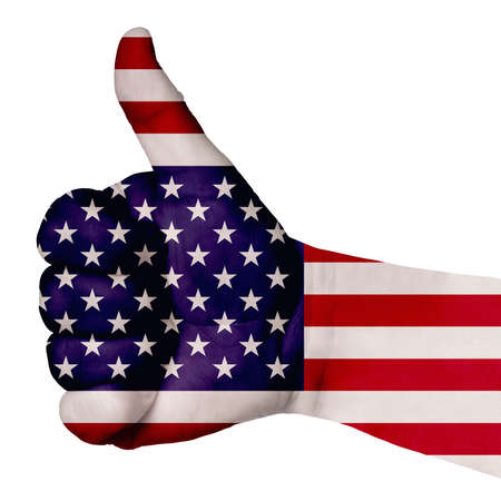 Hand with thumb up gesture in colored america national flag as symbol of excellence, achievement, good, - for tourism and touristic advertising, positive political, social management of countryの写真素材