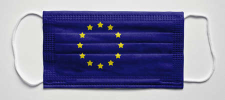European Union flag. PANDEMIA. Medical mask, Medical protective mask on a white...