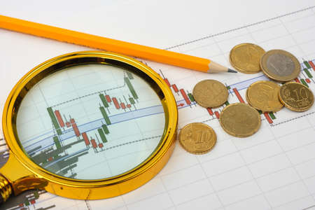 Items of a businessman. Futures, pencil, magnifier and money. Business conceptの写真素材