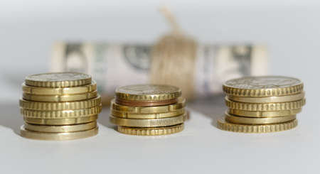 Coins twisted dollars in the background. Background for business ideas and design. Business conceptの写真素材