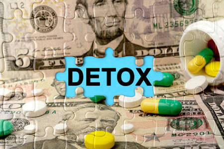 Double exposure. Puzzles depicting pills and dollars with the inscription -DETOX. The concept of medicine.の写真素材