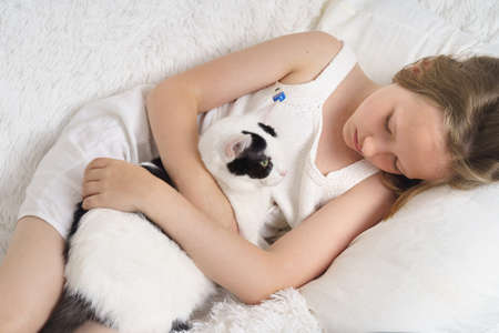 Sick teenage girl wears a medical protective mask. Medical concept.の写真素材