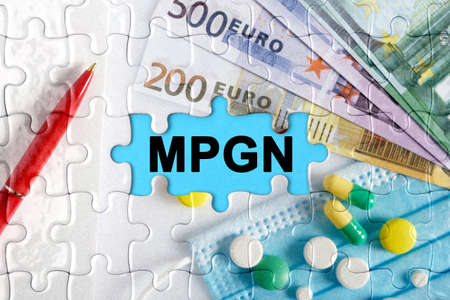 Double exposure. Puzzles with the image of pills, medical mask, pens and euro with the inscription -MPGN. The concept of medicine.の写真素材