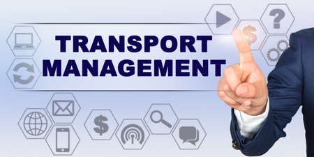 Business concept. Businessman touching virtual screen with his finger. Screen caption - TRANSPORT MANAGEMENTの写真素材