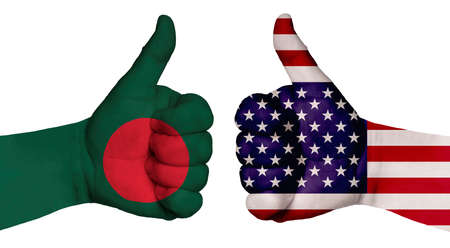 The concept of strengthening the relationship of nations. Two hands are painted with flags of different countries, with a thumb raised up. Bangladesh and the USAの写真素材
