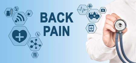 BACK PAIN diagnosis medical and healthcare concept. Doctor with stethoscope.の写真素材