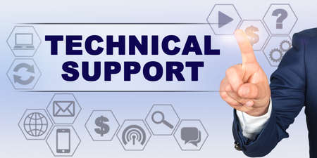 Business concept. Businessman touching virtual screen with his finger. Screen caption - TECHNICAL SUPPORTの写真素材