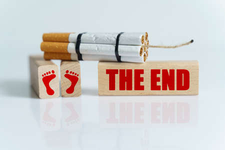 The concept of medicine is the fight against smoking. Cigarettes were twisted into a dynamite checker, and the wick was on wooden dies on which it was written - THE ENDの写真素材