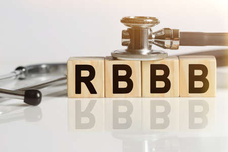 RBBB the word on wooden cubes, cubes stand on a reflective white surface, on cubes - a stethoscope. Medicine conceptの写真素材