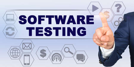 Business concept. Businessman touching virtual screen with his finger. Screen caption - SOFTWARE TESTINGの写真素材
