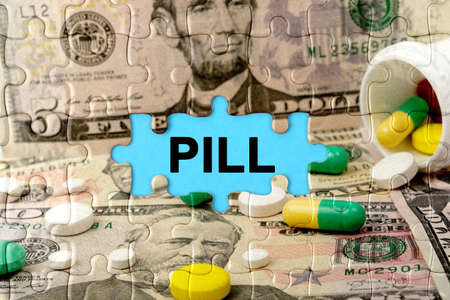 Double exposure. Puzzles depicting pills and dollars with the inscription -PILL. The concept of medicine.の写真素材