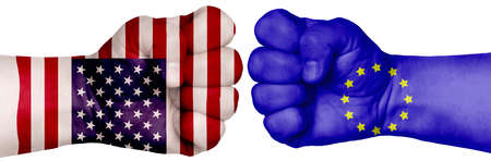 The concept of the struggle of peoples. Two hands are clenched into fists and are located opposite each other. Hands painted in the colors of the flags of the countries. ES vs USAの写真素材
