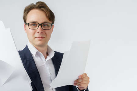 Businessman with scattered papers. Business, people, emotions - businessman throws documents in the...