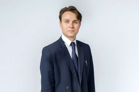 Businessman in a blue suit on a white background. Business and finance conceptの写真素材