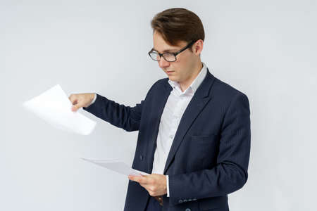 Businessman with scattered papers. Business, people, emotions - businessman throws documents in the...