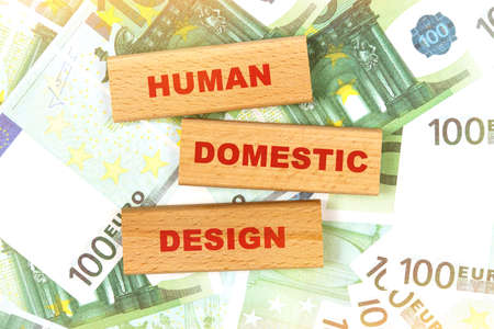 Business concept. Against the background of euro bills, the text is written on wooden blocks - human centered designの写真素材