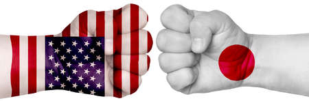 Two hands are clenched into fists and are located opposite each other.の写真素材
