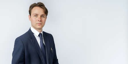 Businessman in a blue suit on a white background. Business and finance conceptの写真素材