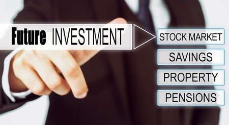 Finance and business concept. Businessman presses button on the interactive screen with the inscription - FUTURE INVESTMENTの写真素材