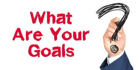 Hand with marker writing: What Are Your Goals. Hand of a businessman with a marker.の写真素材