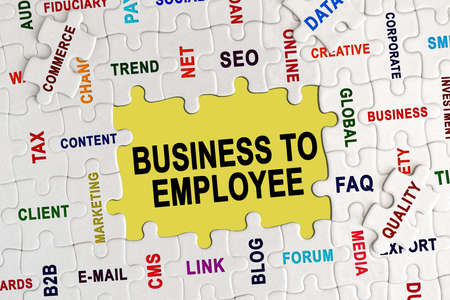 Economy and business concept. Puzzle with economic captions, in the center the inscription - BUSINESS TO EMPLOYEEの写真素材