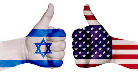 The concept of strengthening the relationship of nations. Two hands are painted with flags of different countries, with a thumb raised up. Israel and the USAの写真素材