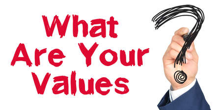 Hand with marker writing: What Are Your Values. Hand of a businessman with a marker.の写真素材