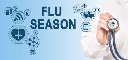 FLU SEASON Concept on Interface Touch Screen. Doctor with stethoscope.の写真素材