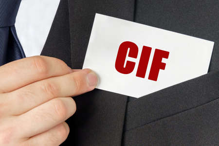 Business concept. Businessman holds a card with the text - CIFの写真素材