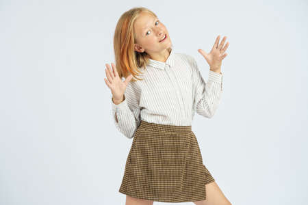 Teenager girl expresses emotions with her hands. Isolated background. Education concept.の写真素材