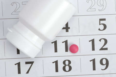 Medicine concept. Planning of reception of tablets on basis of a calendarの写真素材