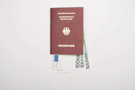 Close up shot of biometric passport with currency. Travel and business conceptの写真素材