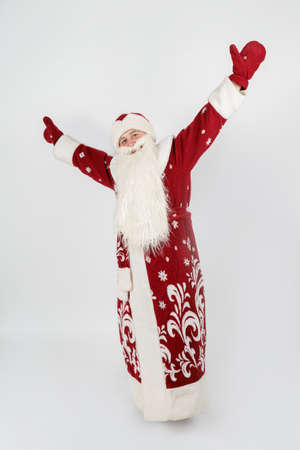 Holidays and christmas concept. Santa Claus is dancing. Isolated on whiteの写真素材