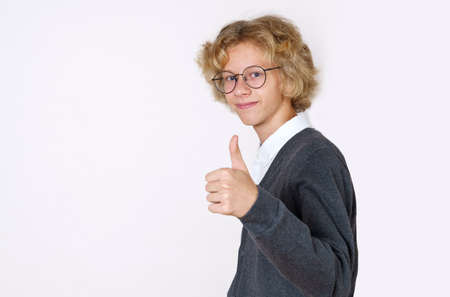 Education concept. Teen boy showing class hand gesture. Isolated over white background.