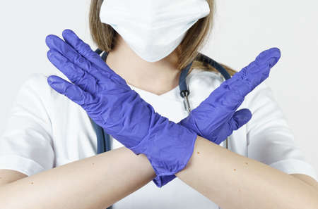 Medicine and health concept. The doctor makes gestures with his hands - stop, prohibited. Isolated on white background.の写真素材