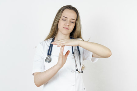Medicine and health concept. The doctor makes gestures with his hands - stop, prohibited. Isolated on white background.の写真素材