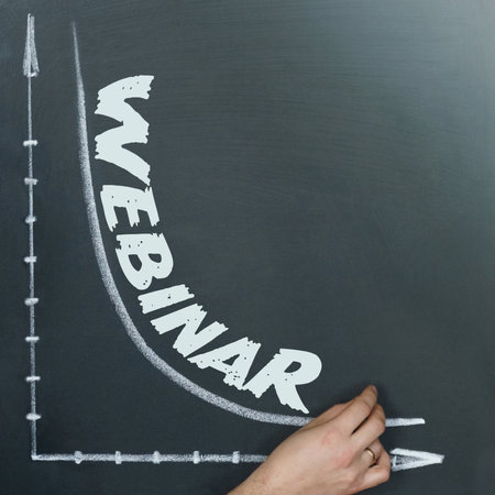 Business and finance concept. A graph is drawn on the board and it is written - WEBINAR