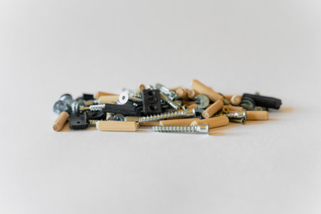 Construction concept. On a white background lies a group of building materials - screws, screws and others.の写真素材