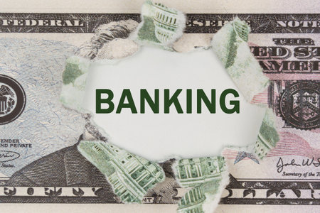Business and finance concept. The dollar is torn in the center. In the center it is written - Bankingの写真素材