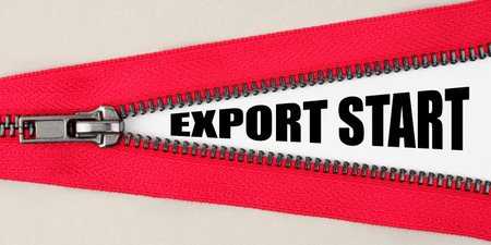 Finance and business concept. On a gray background, a red zipper unfastens, on a white surface the...