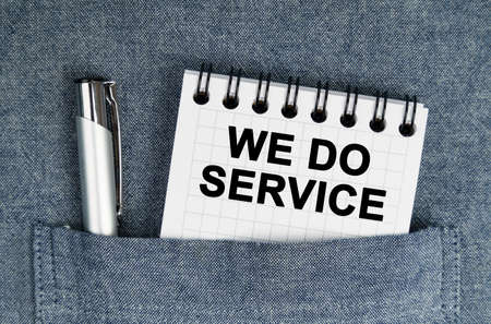 Business and finance concept. In my pocket is a pen and a notebook with the inscription - We do serviceの写真素材